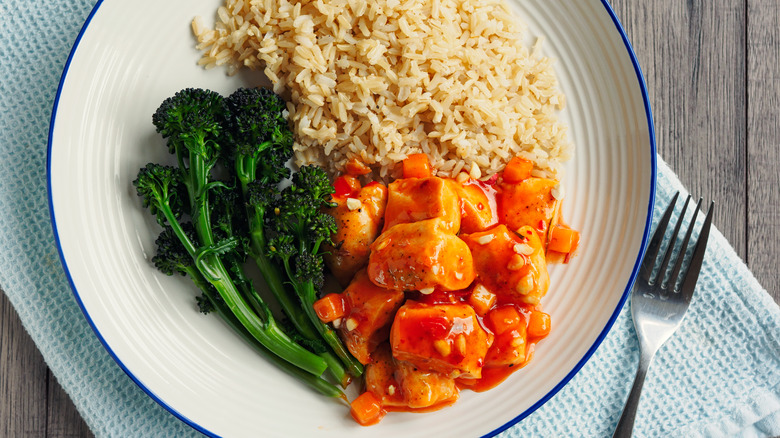 a plate of brown rice and vegetables