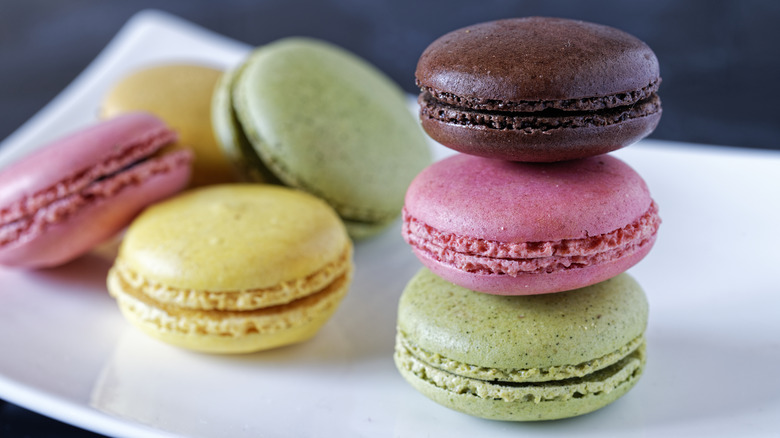 Colorful macarons stacked on a plate