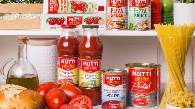 Jars of Mutti pasta and pizza sauce, tubes of tomato paste, and canned tomatoes