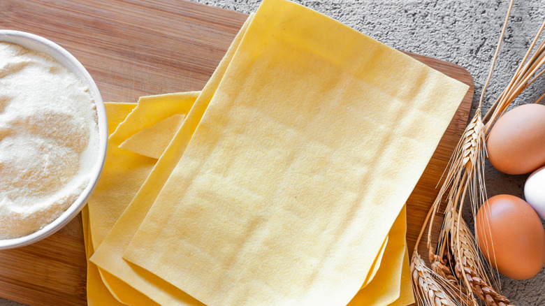 stack of lasagna sheets on a cutting board