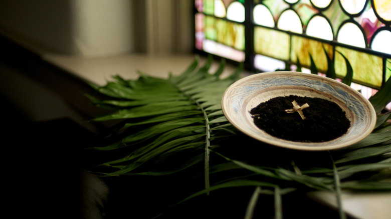 bowl of ashes for Lent services in church window