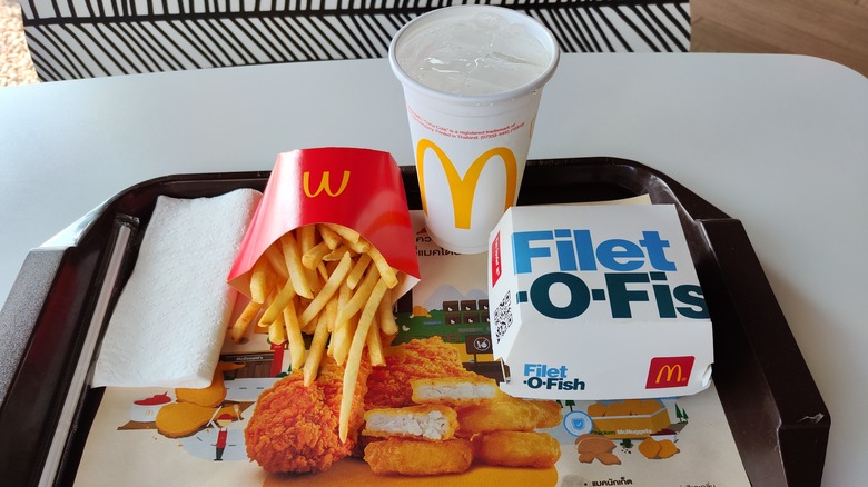 Filet O Fish on tray with french fries and a soft drink