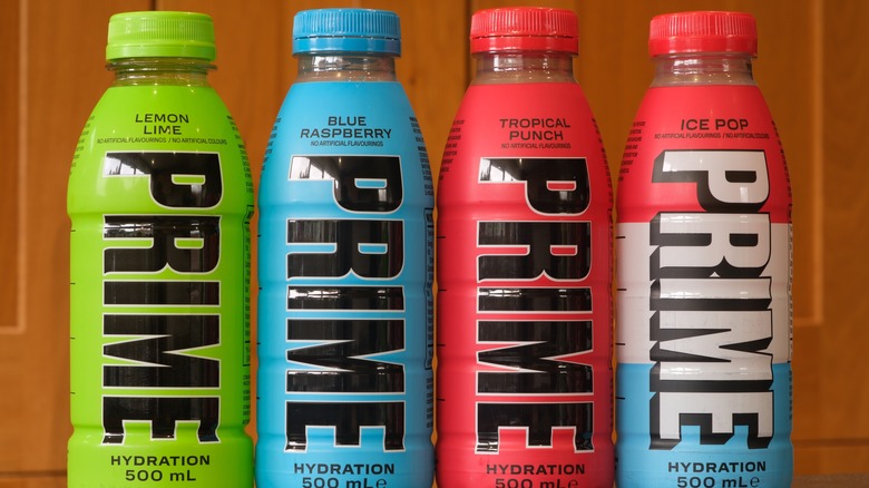 4 colored bottles of Prime energy drink