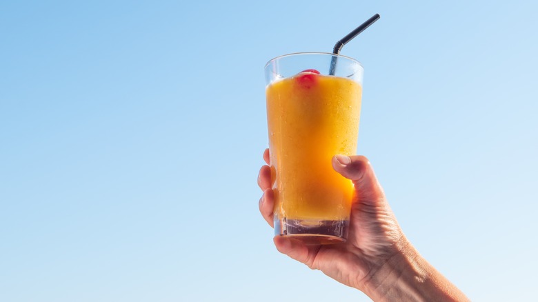 Person holding a cocktail