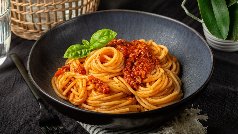 Bowl of spaghetti bolognese with garnish