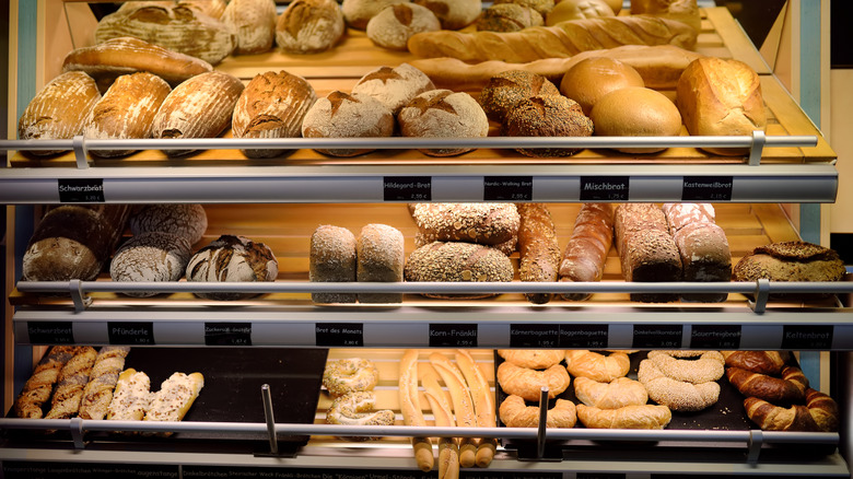 An assortment of baked goods in a bakery display case