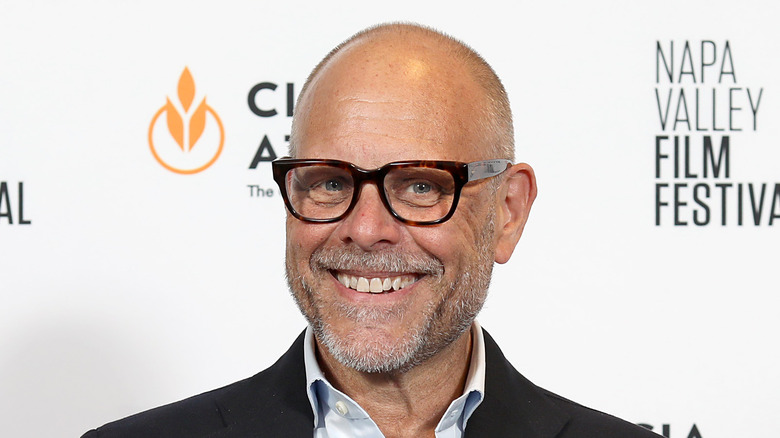 Alton Brown smiling on red carpet