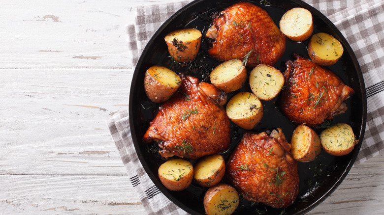 Roasted chicken thighs and potatoes glazed with maple syrup