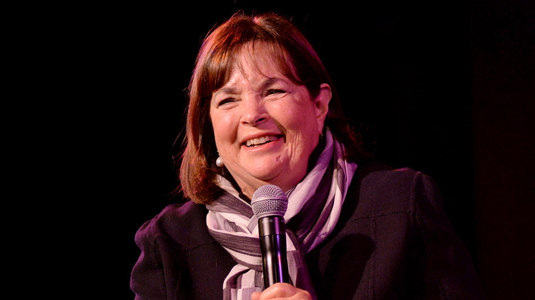 Ina Garten sitting on stage with a microphone.