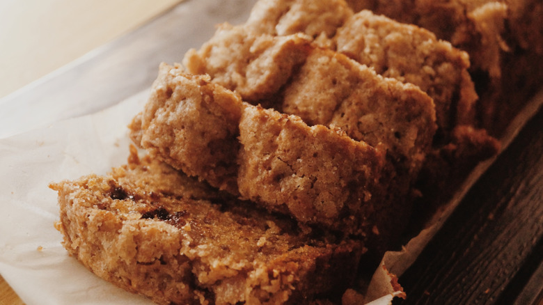 Sliced loaf of banana bread with streusel topping