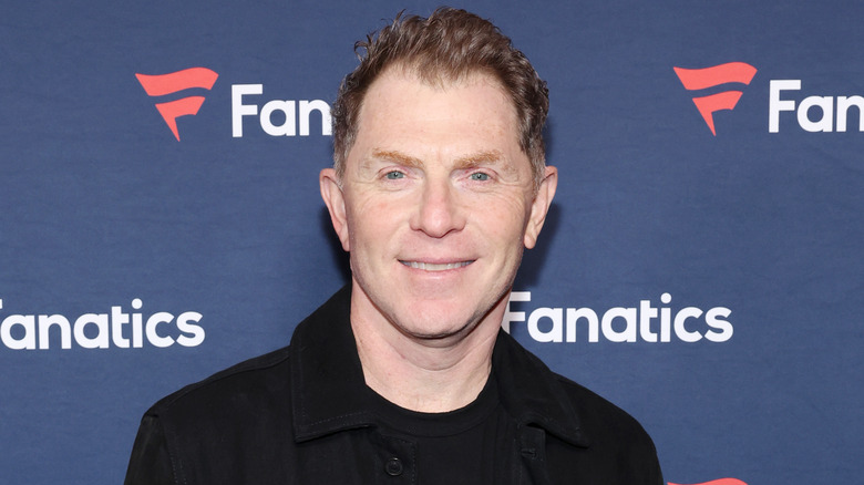 Bobby Flay smiling at Fanatics red carpet event