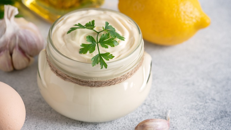 Glass jar of garlic and lemon aioli