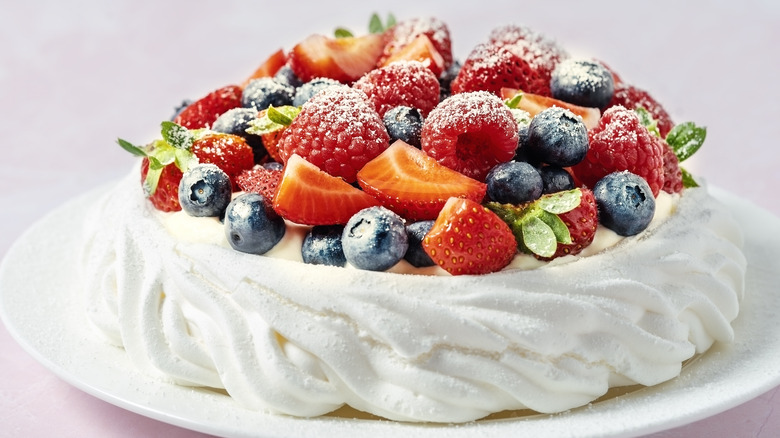 pavlova topped with fresh berries