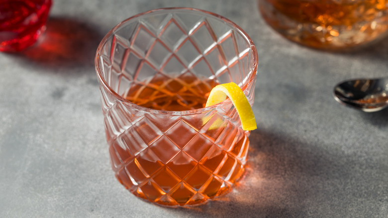 sazerac cocktail with lemon peel