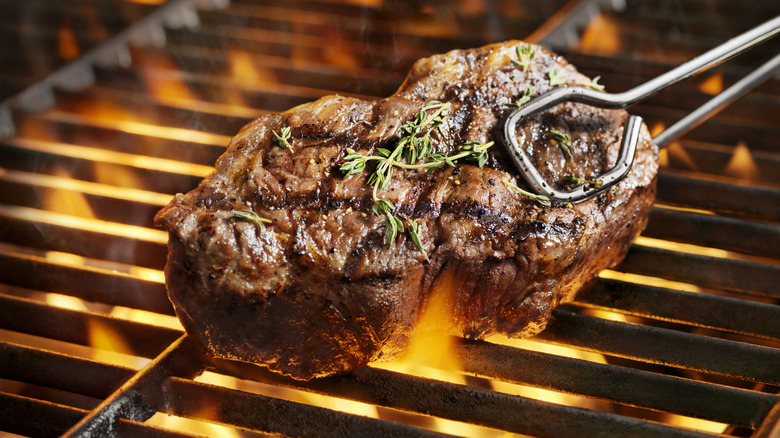 Sirloin steak being cooked on a grill