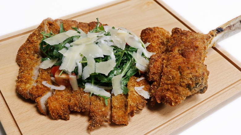 veal milanese with arugula and cheese