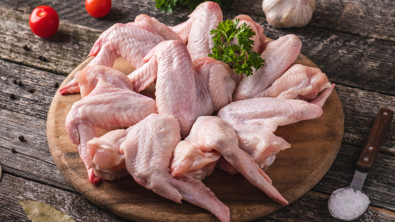 chicken wings on wooden board