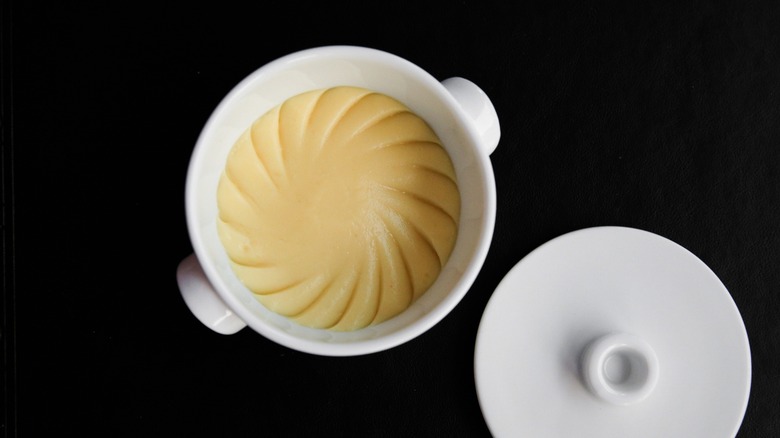 Robuchon's iconic mashed potatoes in a white pot