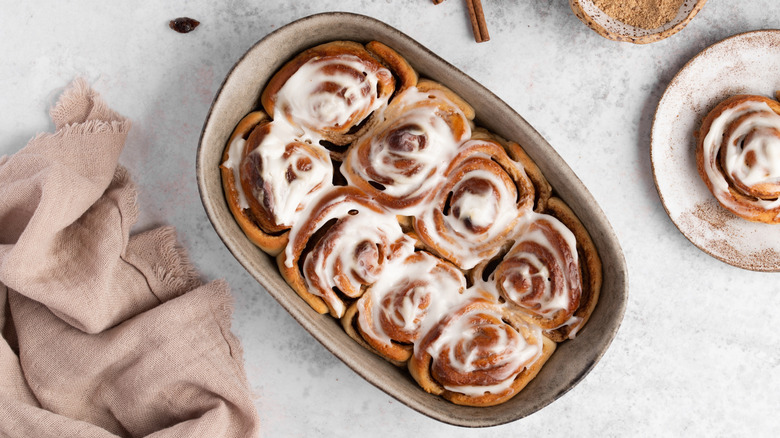 Dish of fresh cinnamon rolls with icing