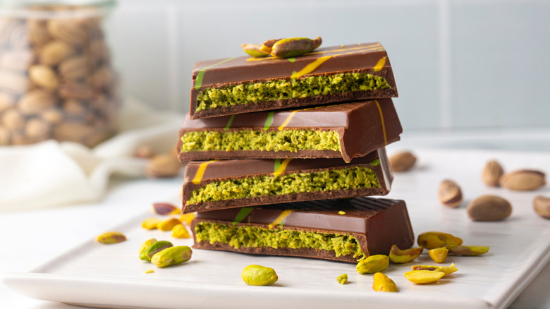 Stacks of Dubai chocolate bars filled with pistachio and knafeh