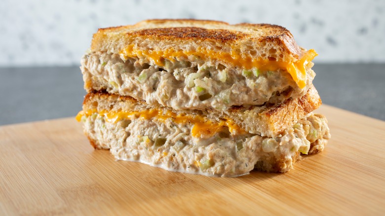 A tuna melt sandwich on a cutting board