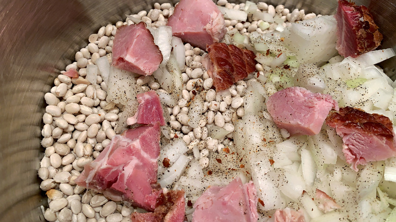 Navy beans, ham, and onion in pot