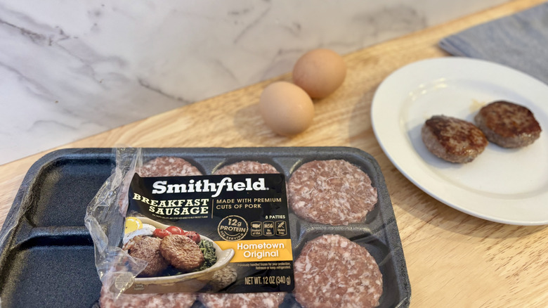 Smithfield sausages on a white plate