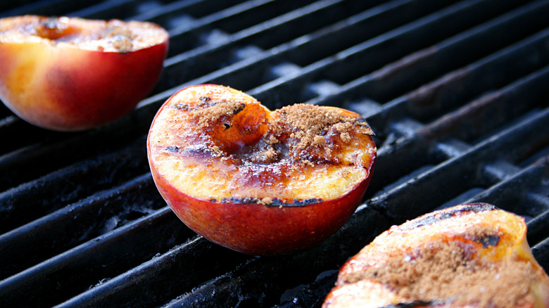 peach halves on a grill