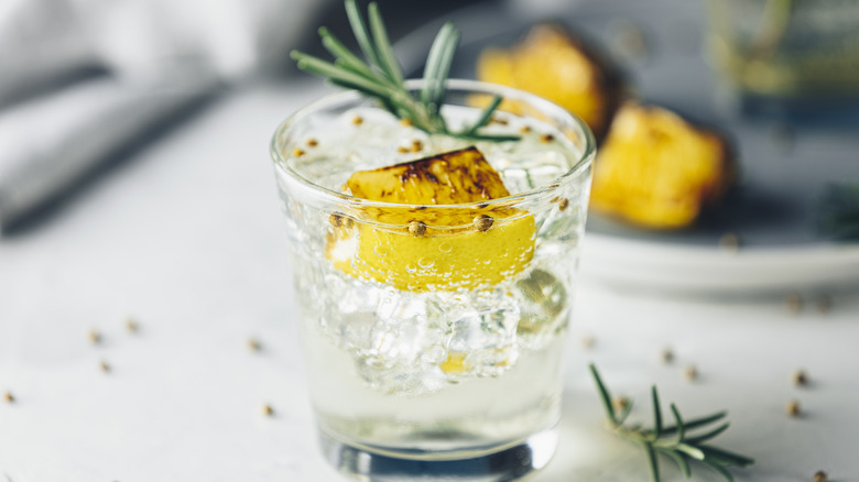 grilled lemon and rosemary in a cocktail