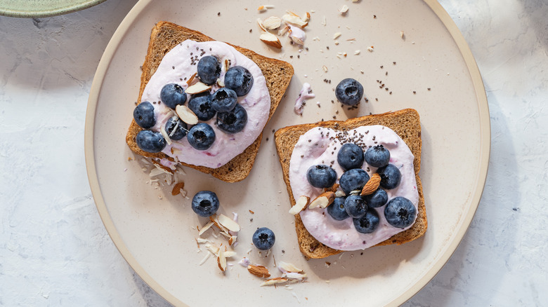 blueberries and whipped cream cheese on toast