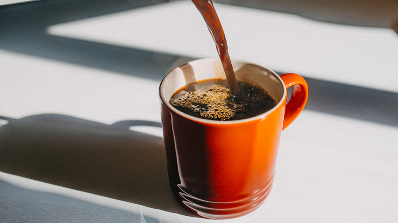 Coffee being poured into mug