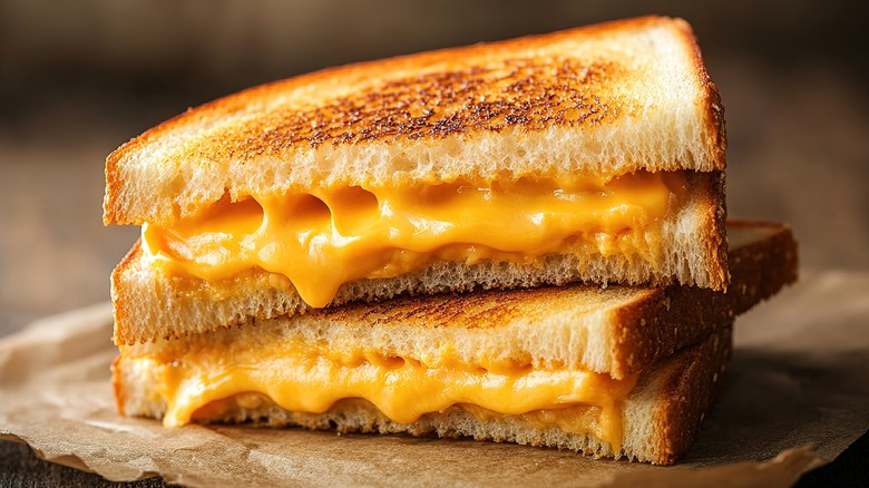 Two grilled cheese sandwich halves stacked