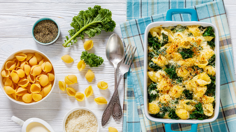 baked pasta with kale, black pepper, shell noodles, and parmesan cheese