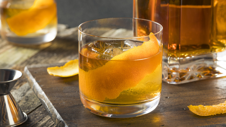 Old fashioned bourbon cocktail with orange