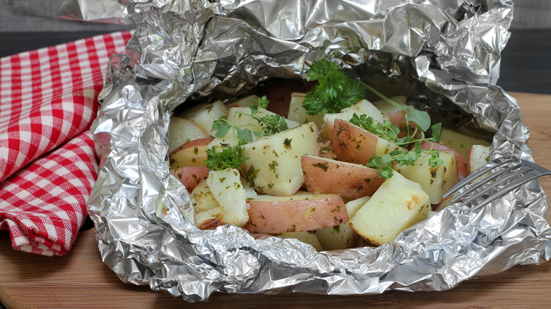 Grilled potatoes in foil wrap