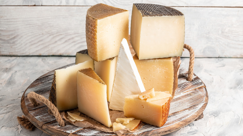 Assorted cheeses on wood