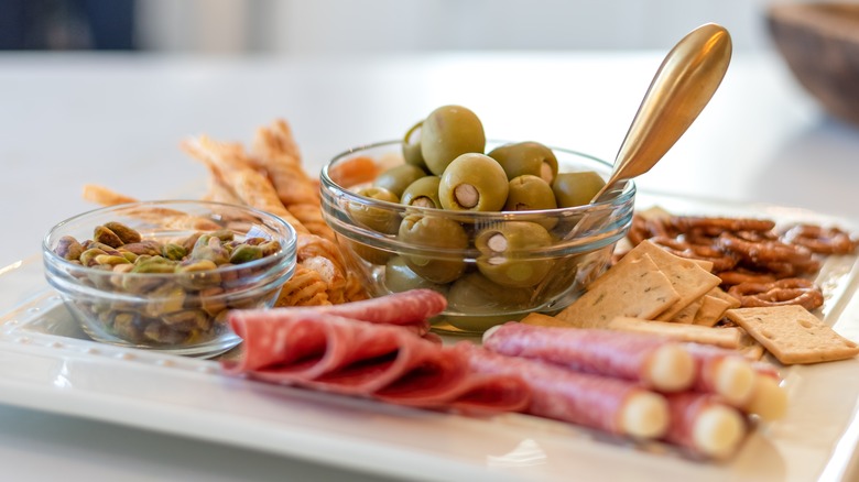 Charcuterie board olives meat