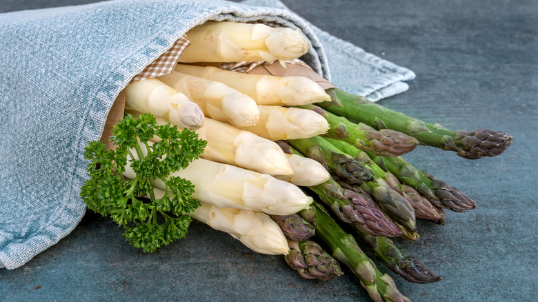 White and green asparagus under a towel