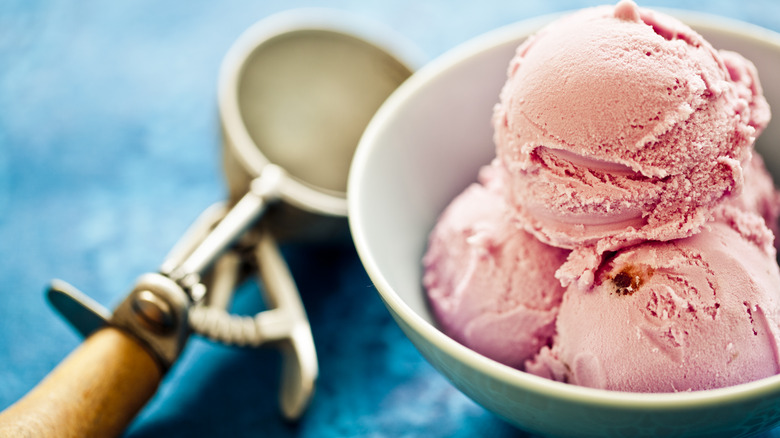 scoops of strawberry ice cream in a bowl