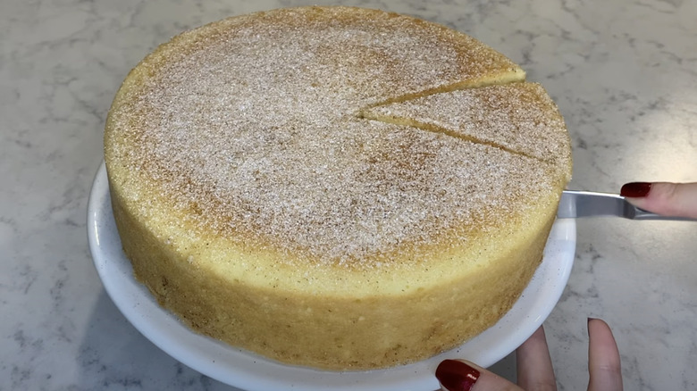 snickerdoodle cake being cut