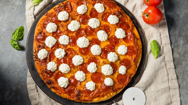 Pepperoni pizza dotted with ricotta