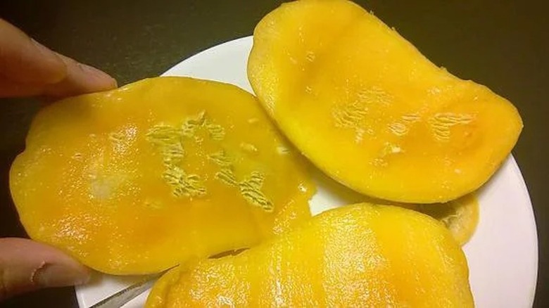 sliced mango with white spots