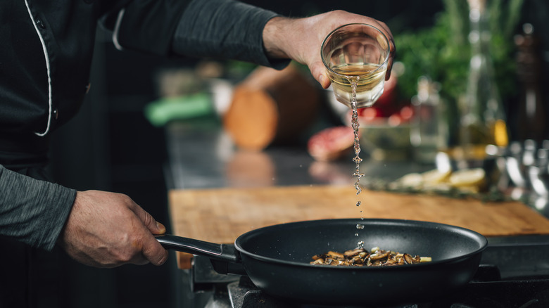 Adding clear liquid to pan