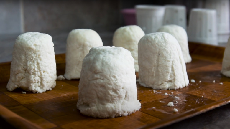 Pule cheeses on cutting board