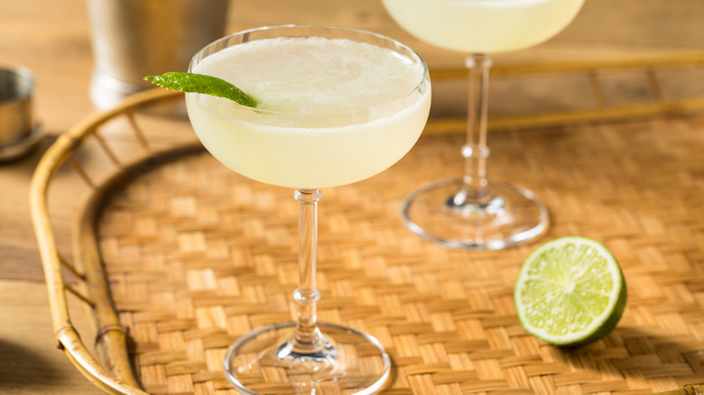 Lime Daiquiri on woven tray with half lime