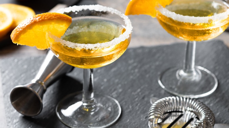 Sidecar cocktail with sugared rim and orange