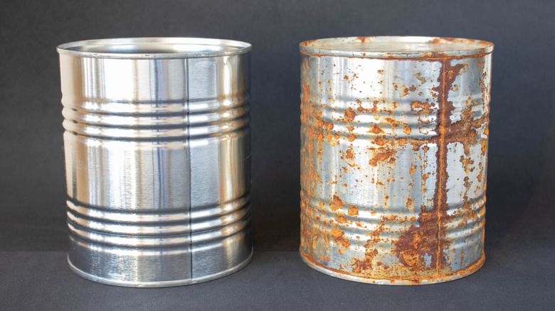 two cans with one covered in rust