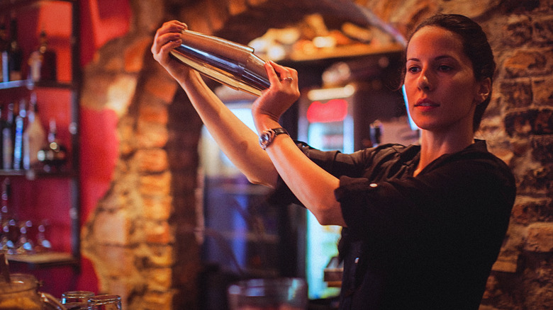 woman bartender with cocktail shaker