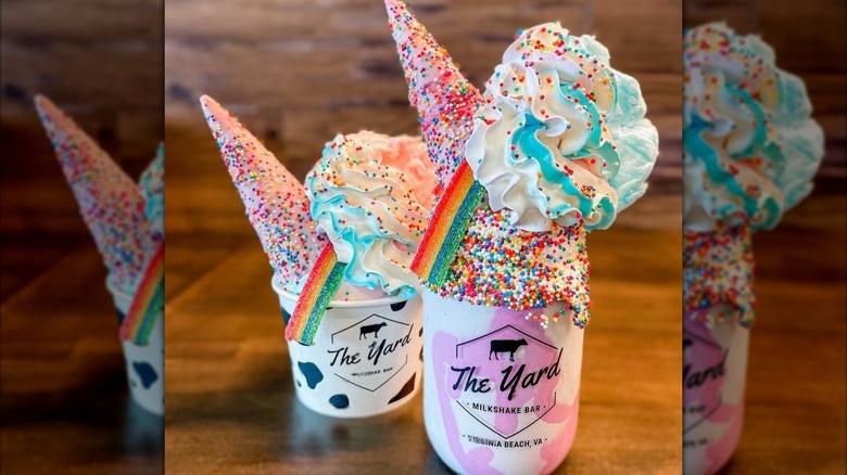 The Yard's unicorn sundae next to a unicow ice cream cup