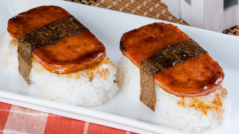 Two spam musubi pieces on blocks of rice